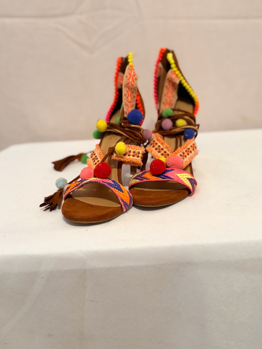 Anna Michelle colorful pom-pom lace-up stiletto sandals.